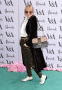 <p>Wearing a dramatic velvet overcoat and metallic trousers. <i>[Photo: PA Images]</i></p>