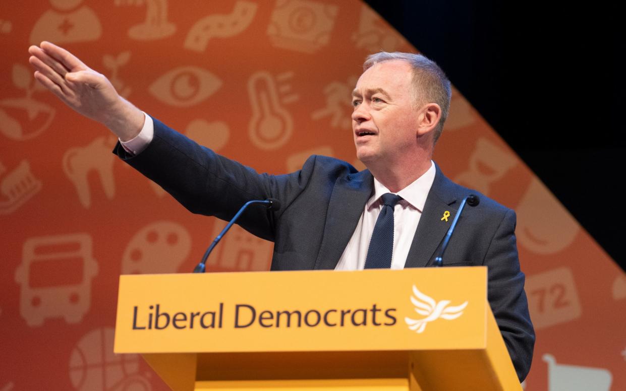 Tim Farron chairs a session at the party conference in Brighton