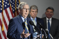 Senate Majority Leader Mitch McConnell of Ky., left, speaks to reporters following the weekly Republican policy luncheon on Capitol Hill in Washington, Tuesday, June 9, 2020. Sen. Roy Blunt, R-Mo., center, and Sen. Cory Gardner, R-Colo., right, listen. (AP Photo/Susan Walsh)