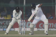 India's Ravichandaran Ashwin plays a shot during the day four of their first test cricket match with New Zealand in Kanpur, India, Sunday, Nov. 28, 2021. (AP Photo/Altaf Qadri)