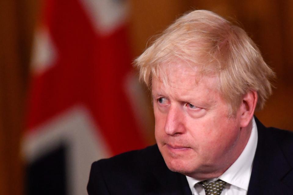 Britain's Prime Minister Boris Johnson speaks during a virtual press conference inside 10 Downing Street in central London on October 12, 2020, after announcing a new COVID-19 alert system. - British Prime Minister Boris Johnson on Monday ordered pubs in Liverpool to shut as part of a new strategy to tackle a surge in coronavirus cases, as staff at three field hospitals across the country were told to prepare for a wave of admissions. The northwest English city is the first to be placed at "very high risk" under a new three-tiered system designed to bring order what has become a complex web of local restrictions. (Photo by TOBY MELVILLE / POOL / AFP) (Photo by TOBY MELVILLE/POOL/AFP via Getty Images)