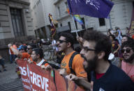 Oil workers march against layoffs at the state oil company Petrobras, in Rio de Janeiro, Brazil, Tuesday, Feb. 18, 2020. Brazilian oil workers and oil giant Petrobras were locked in a power struggle Tuesday over the company's privatization plans, with the union saying thousands of employees are on an indefinite strike. (AP Photo/Silvia Izquierdo)