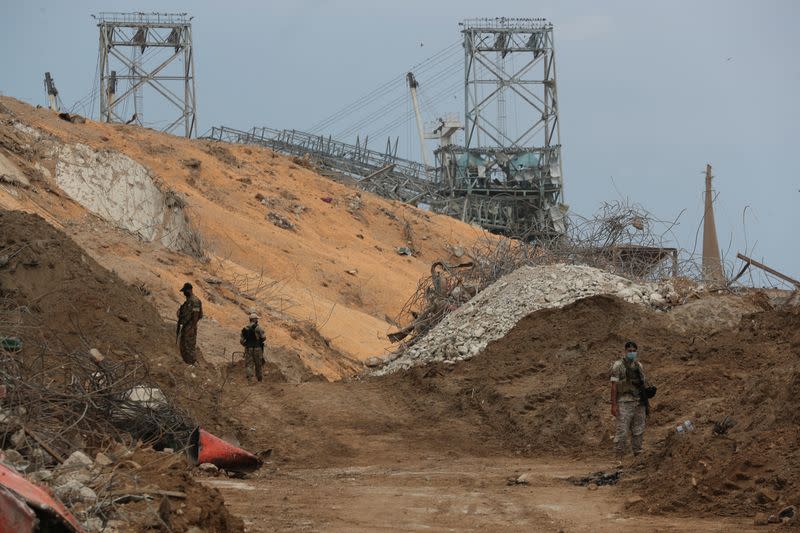 Soldiers patrol at the devastated site of the explosion at the port of Beirut