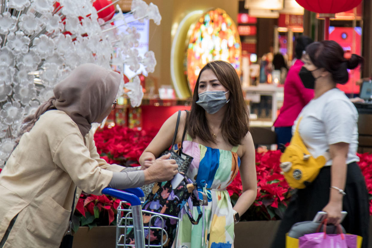 A female traveller seen wearing a face mask at Changi Airport's Terminal 3 transit area on 6 February 2020. (PHOTO: Dhany Osman / Yahoo News Singapore)