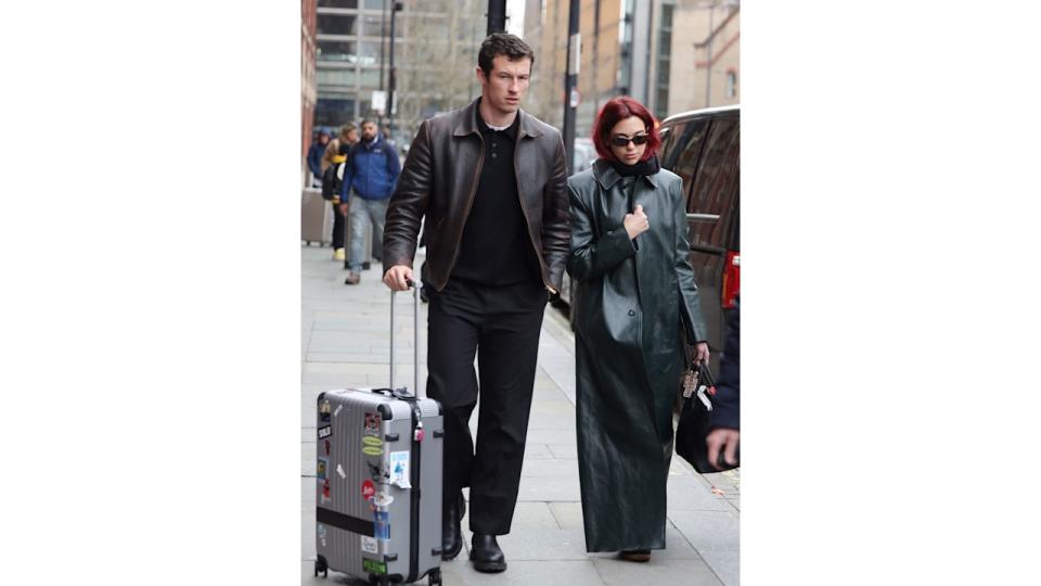 Dua Lipa and Callum Turner arriving at London St Pancras Station after taking the Eurostar from Paris on March 26, 2024 in London, England