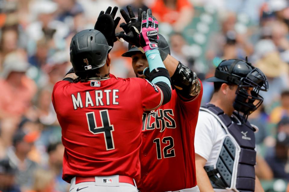 Arizona Diamondbacks designated hitter Lourdes Gurriel Jr. (12) is congratulated by second baseman Ketel Marte (4) after hitting a three-run home run in the fifth inning against the Detroit Tigers at Comerica Park in Detroit on Saturday, June 10, 2023.
