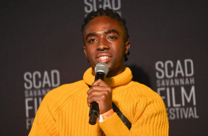 Check out these young, Black actors who are taking the entertainment industry by storm and leaving their mark on it in the process. Pictured: Caleb McLaughlin holding a mic at an Entertainment Weekly event in 2021. | Paras Griffin/Getty Images