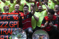 Ferrari driver Charles Leclerc, centre, of Monaco celebrates with his team after winning the Australian Formula One Grand Prix in Melbourne, Australia, Sunday, April 10, 2022. (AP Photo/Asanka Brendon Ratnayake)