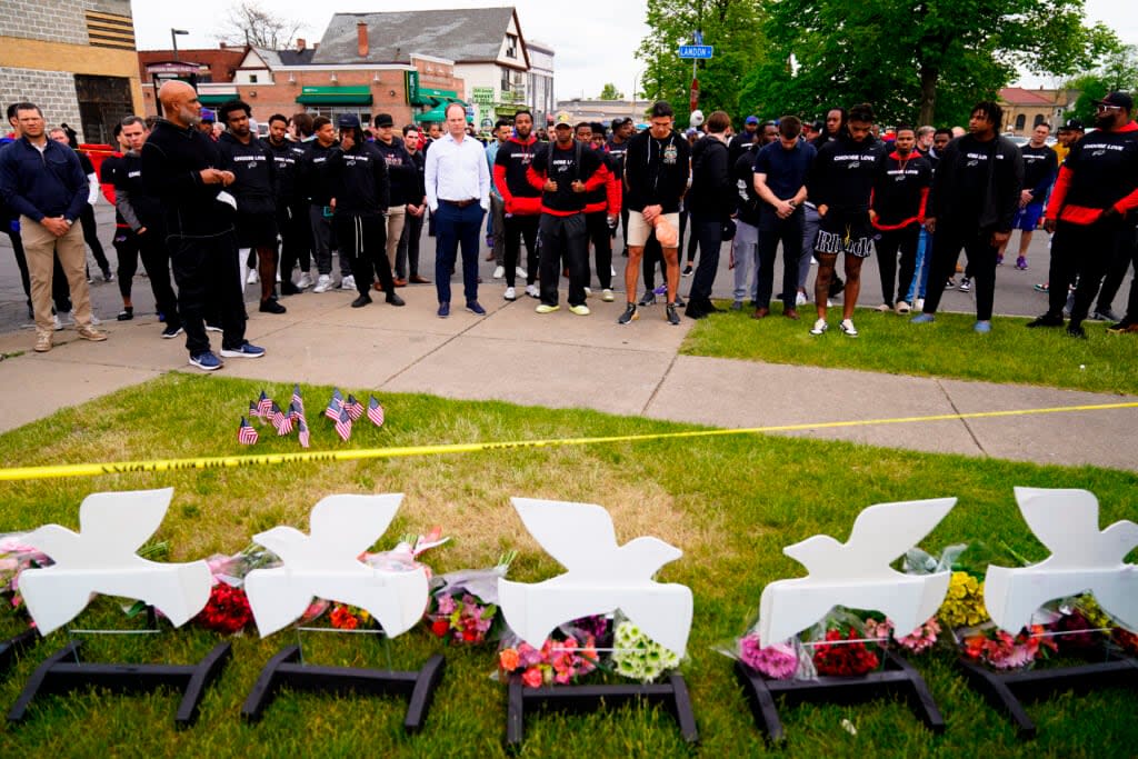 Members of the Buffalo Bills visit the scene of Saturday’s shooting at a supermarket, in Buffalo, N.Y., Wednesday, May 18, 2022. (AP Photo/Matt Rourke)