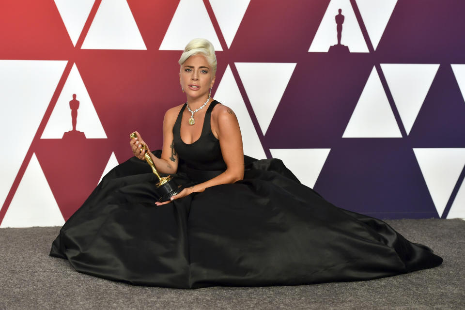 FILE - Lady Gaga, winner of the award for best original song for "Shallow" from "A Star Is Born", poses in the press room at the Oscars on Sunday, Feb. 24, 2019, at the Dolby Theatre in Los Angeles. Officials say Lady Gaga’s dog walker was shot and her two French bulldogs stolen in Hollywood during an armed robbery. Los Angeles police are seeking two suspects, thought it’s not known if both were armed, in connection with the Wednesday night shooting. (Photo by Jordan Strauss/Invision/AP, File)