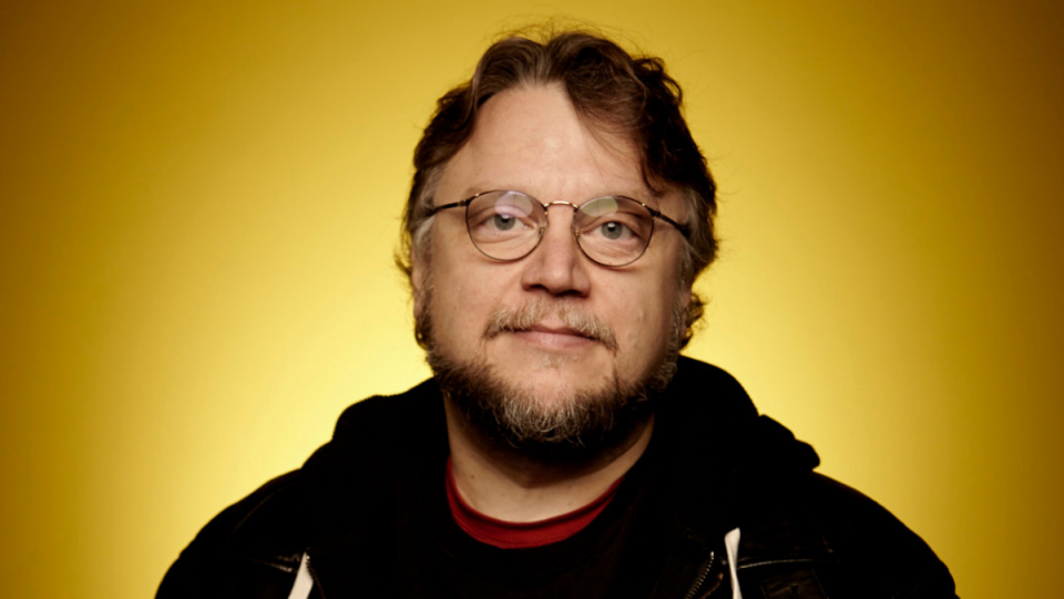 Writer, director, producer Guillermo Del Toro against a bright yello backdrop for Cabinet of Curiosities