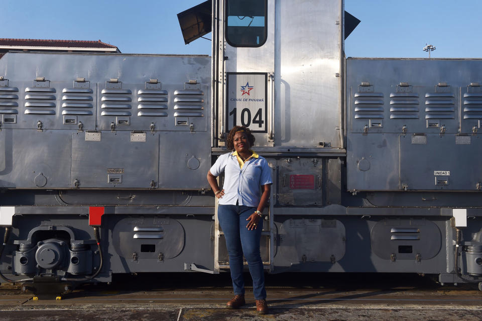 <p>Locomotive, or “mule,” operator Glaciela Shreeves, 53, poses for pictures at the Panama Canal’s Pedro Miguel Locks, where she works towing ships through the locks, on the outskirts of Panama City on February 22, 2018. (Photo: Rodrigo Arangua/AFP/Getty Images) </p>