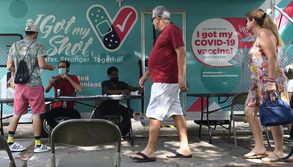 people at a mobile vaccination site