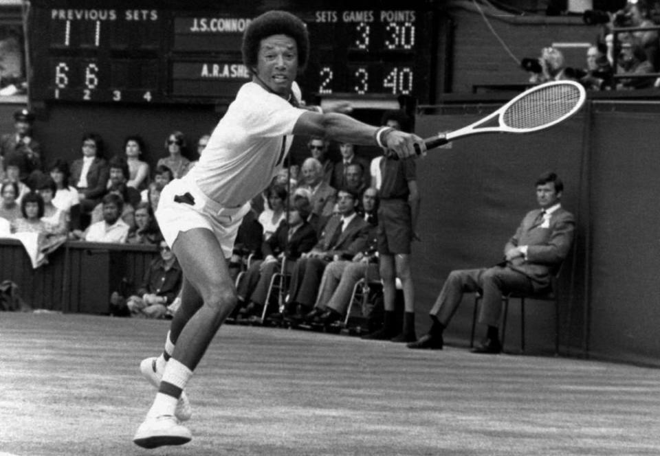 Arthur Ashe n action against Jimmy Connors at Wimbledon in 1975.