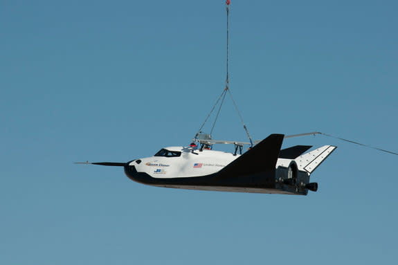 NASA partner Sierra Nevada Corporation (SNC) of Louisville, Colo., performs a captive-carry test of the Dream Chaser spacecraft Thursday at NASA's Dryden Flight Research Center in Edwards, Calif.