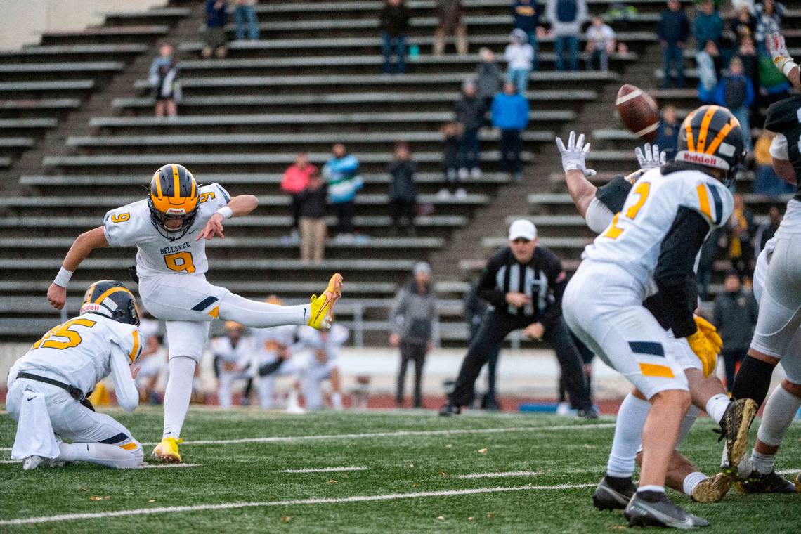 Bellevue’s Luke Scoma attempts a 43-yard field goal with 16.5 seconds to play in the fourth quarter of a Class 3A state quarterfinal game against Lincoln on Saturday, Nov. 19, 2022, at the Lincoln Bowl in Tacoma, Wash. Scoma’s field goal squeaked over the cross bar then bounced back onto the field on play. The ricochet caused confusion for both teams. Lincoln players ran toward their sideline exuberant that they had held on for the win, while the referees underneath the goal posts were calling the kick good. Scoma’s field goal won the game for the Wolverines, 22-20.