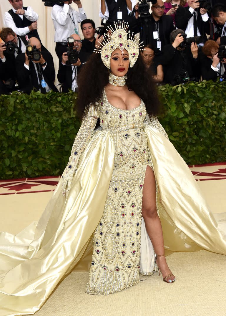 <p>A pregnant Cardi B turned heads when she arrived in a bejeweled gown for the Heavenly Bodies: Fashion and the Catholic Imagination-themed Met Gala.</p>