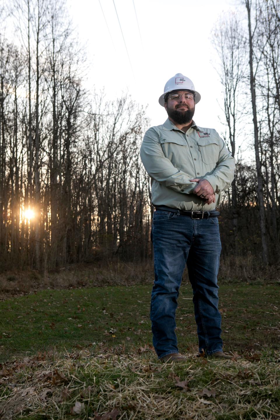 Joe Alexander, American Electric Power forrester in the Chillicothe District, stands in front of the pollinator garden at Buzzard's Roost Nature Preserve on November 16, 2023, in Chillicothe, Ohio.