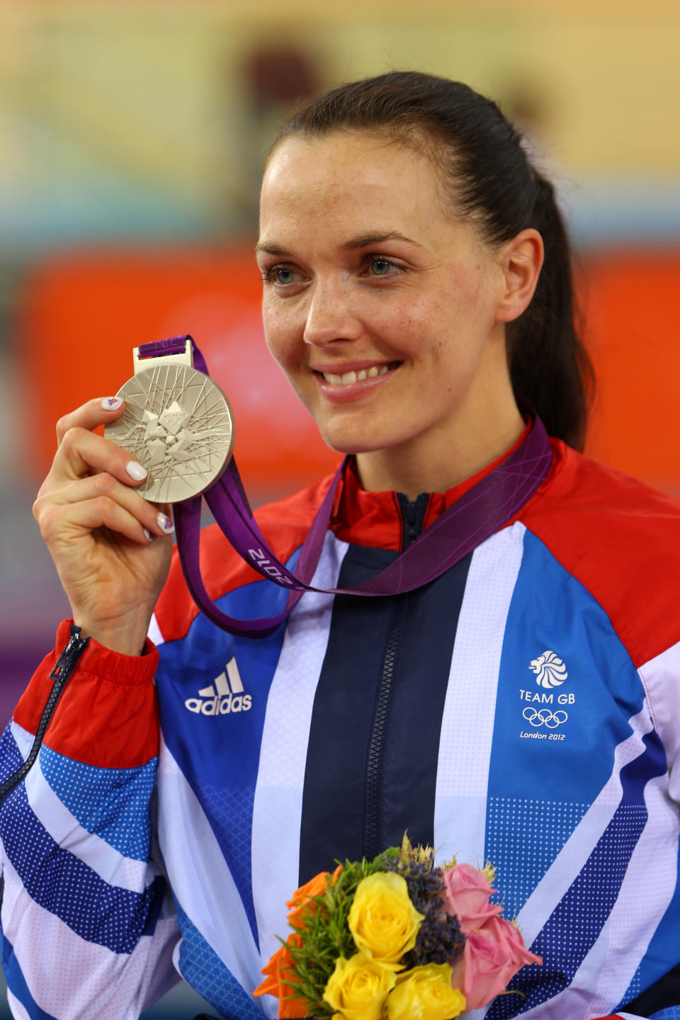 LONDON, ENGLAND - AUGUST 07: Silver medallist Victoria Pendleton of Great Britain celebrates during the medal ceremony for the Women's Sprint Track Cycling Final on Day 11 of the London 2012 Olympic Games at Velodrome on August 7, 2012 in London, England. (Photo by Phil Walter/Getty Images)