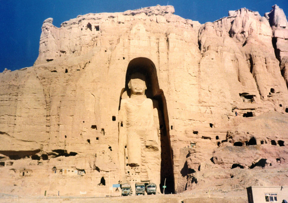 FILE - The 53-meter (175-foot) tall, 2000-year-old Buddha statue located in Bamyan, about 150 kilometers (90 miles) west of the Afghan capital Kabul, is shown in November 28, 1997, file photo. The former Soviet Union marched into Afghanistan on Christmas Eve, 1979, claiming it was invited by the new Afghan communist leader, Babrak Karmal, setting the country on a path of 40 years of seemingly endless wars and conflict. After the Soviets left in humiliation, America was the next great power to wade in. (AP Photo/Zaheeruddin Abdullah)