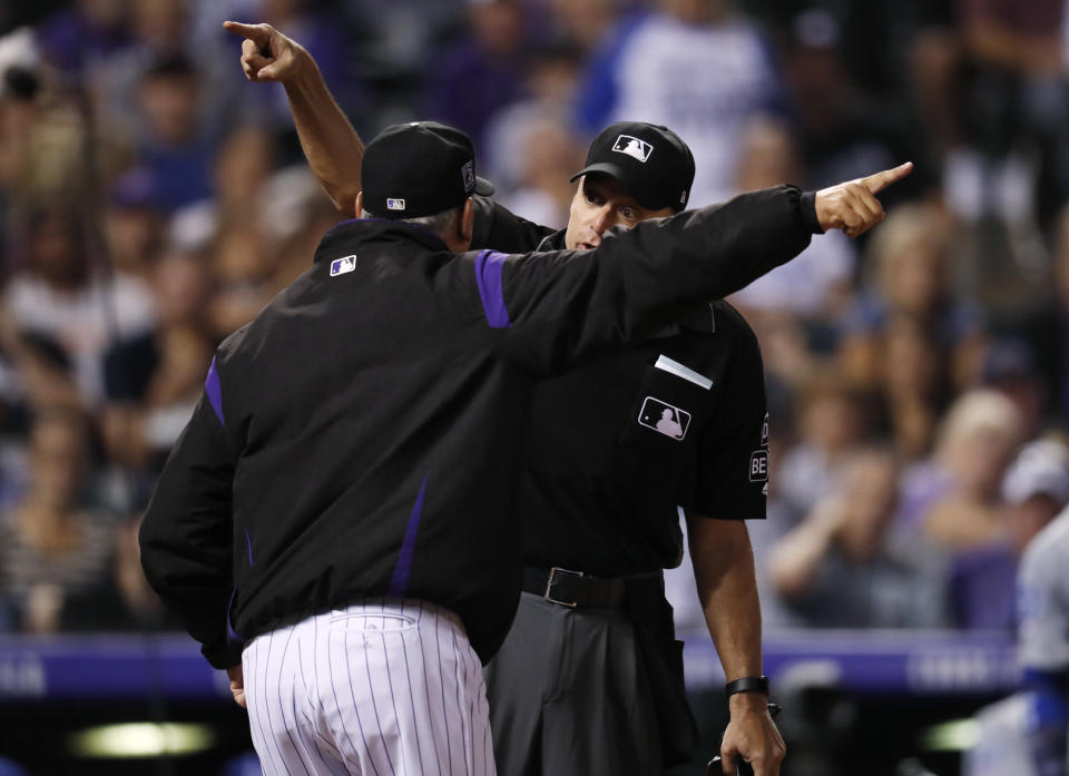 Colorado Rockies manager Bud Black, front, argues with home plate umpire Andy Fletcher after he called a balk against Rockies relief pitcher Chris Rusin while facing the Los Angeles Dodgers in the fifth inning of a baseball game Friday, Sept. 7, 2018, in Denver. (AP Photo/David Zalubowski)