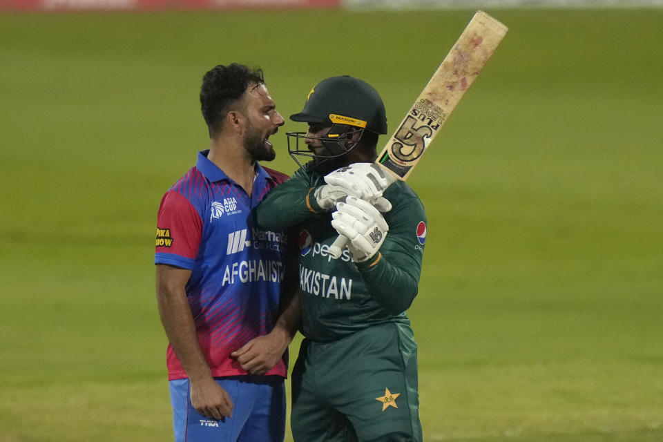 Afghanistan's Fareed Ahmad, left, and Pakistan's Asif Ali, right, react after Ali was dismissed by Ahmad during the T20 cricket match of Asia Cup between Pakistan and Afghanistan, in Sharjah, United Arab Emirates, Wednesday, Sept. 7, 2022. (AP Photo/Anjum Naveed)