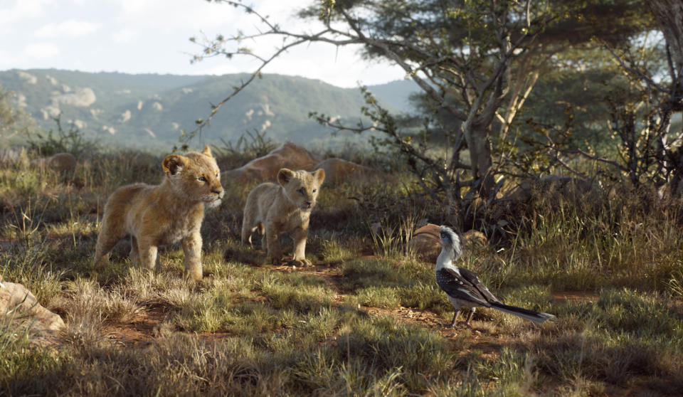 This image released by Disney shows, from left, young Simba, voiced by JD McCrary, young Nala, voiced by Shahadi Wright Joseph, and Zazu, voiced by John Oliver, in a scene from "The Lion King." (Disney via AP)