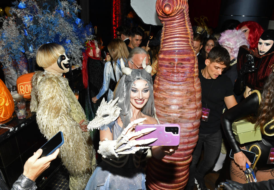 Heidi talking a selfie with a party guest