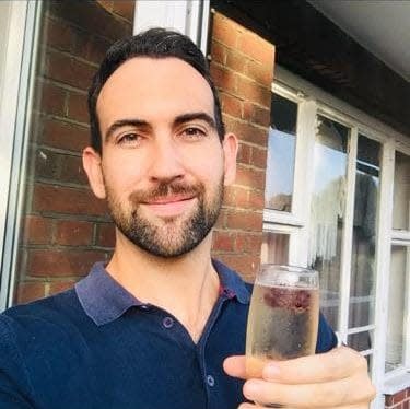 Jamie with his old go-to drink: a glass of Prosecco