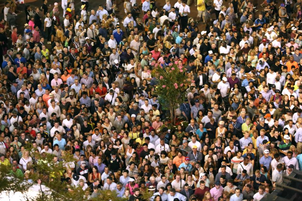 People arrive at the match of Venus Williams against Serena Williams during their 2015 US Open Women's Singles Quarter Finals match at the USTA Billie Jean King National Tennis Center September 8, 2015 in New York. AFP PHOTO/KENA BETANCUR        (Photo credit should read KENA BETANCUR/AFP/Getty Images)