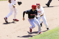 North Carolina State's Vojtech Mensik, left, gets caught in a rundown between second and third bases as he is tagged out by Stanford's Adam Crampton (10) in the fourth inning in the opening baseball game of the College World Series Saturday, June 19, 2021, at TD Ameritrade Park in Omaha, Neb. (AP Photo/Rebecca S. Gratz)