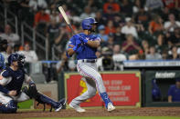 Texas Rangers' Leody Taveras, right, hits a three-run double as Houston Astros catcher Christian Vazquez watches during the 10th inning of a baseball game Wednesday, Aug. 10, 2022, in Houston. (AP Photo/David J. Phillip)