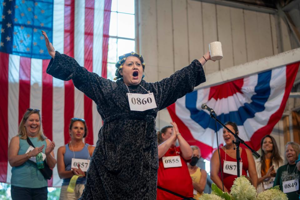 Christie Lewis of the Amana Colonies competes in the Husband Calling Contest.