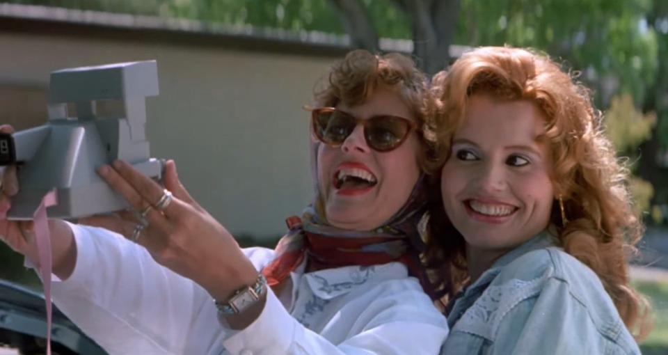 Thelma and Louise taking a picture together in "Thelma and Louise"