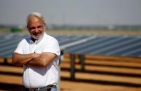 Christopher Cantelmi, Principal Infrastructure Department at IFC looks on during an interview with Reuters near photovoltaic panels at the Benban plant in Aswan