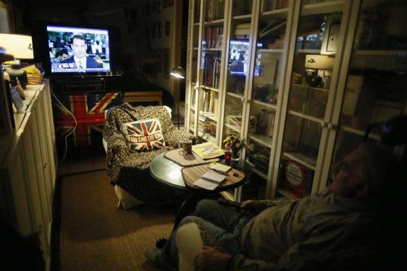 Ted Schorling, 76, watches television in Village Trailer Park in Santa Monica, July 12, 2012.