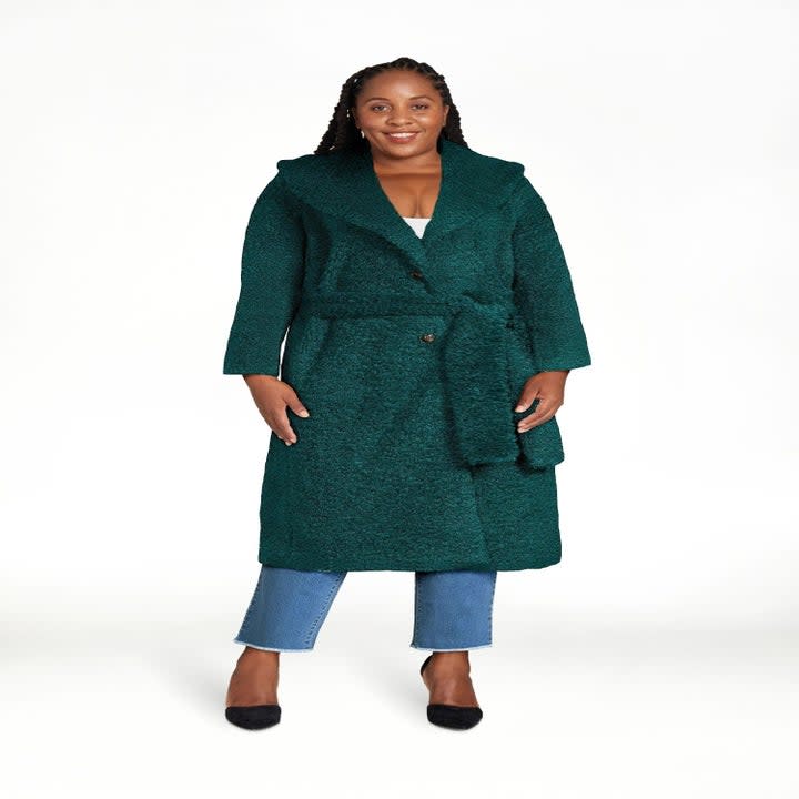 model wearing the green coat