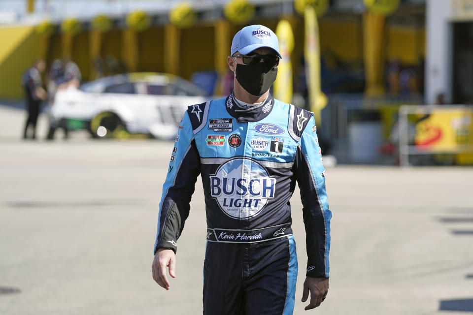 Kevin Harvick heads to his garage before a NASCAR Daytona 500 auto race practice session at Daytona International Speedway, Wednesday, Feb. 10, 2021, in Daytona Beach, Fla. (AP Photo/John Raoux)