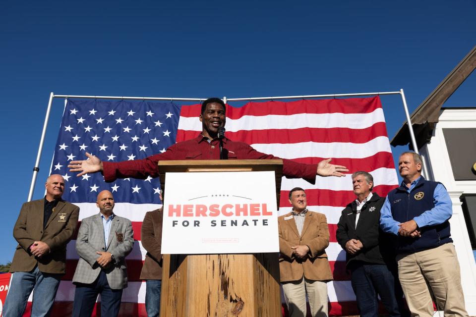 Georgia Republican Senate nominee Herschel Walker speaks to a crowd on Oct. 20, 2022, in Macon, Ga. <a href="https://media.gettyimages.com/photos/georgia-republican-senate-nominee-herschel-walker-addresses-the-crowd-picture-id1244103333?s=612x612" rel="nofollow noopener" target="_blank" data-ylk="slk:Jessica McGowan/Getty Images;elm:context_link;itc:0;sec:content-canvas" class="link ">Jessica McGowan/Getty Images</a>