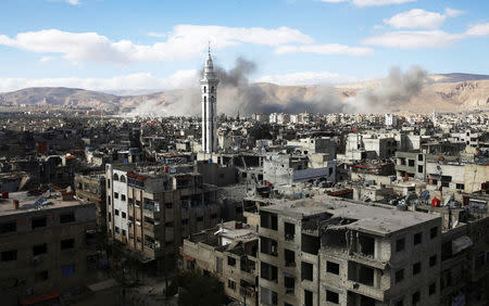 Smoke rises from the besieged Eastern Ghouta in Damascus, Syria, February 27, 2018. REUTERS/ Bassam Khabieh