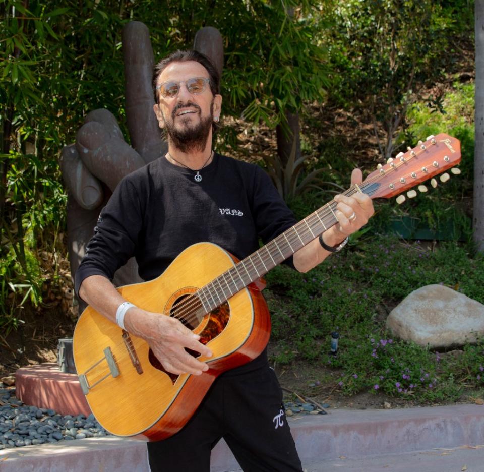 Ringo Starr with his late Beatles bandmate John Lennon’s guitar after it was recently found in an attic after 50 years. Scott Ritchie/ Julien's/ MEGA