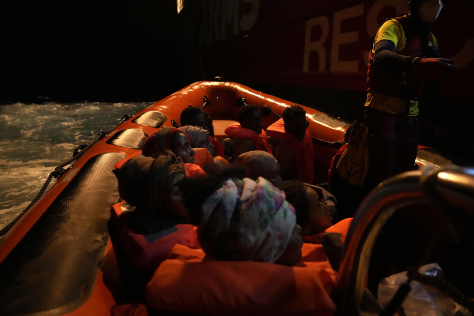 Migrants rescued by members of the Spanish NGO Open Arms during a rescue operation in international waters zone at the Mediterranean sea early Sunday, Sept. 18, 2022. Around 200 migrants from Syria and Africa countries were rescued by NGO Open Arms crew members. (AP Photo/Petros Karadjias)