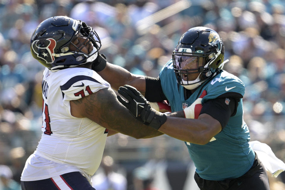 Houston Texans offensive tackle Tytus Howard (71) blocks Jacksonville Jaguars linebacker Travon Walker (44) during the second half of an NFL football game in Jacksonville, Fla., Sunday, Oct. 9, 2022. (AP Photo/Phelan M. Ebenhack)