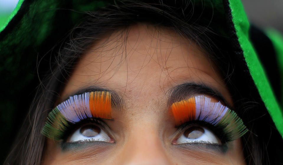 A woman wears false flag eyelashes during the St Patrick's day parade through Dublin city centre on St Patrick's day, Sunday March 17, 2013. (AP Photo/PA, Julien Behal)UNITED KINGDOM AND ALL IRELAND OUT