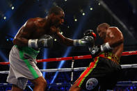 ATLANTIC CITY, NJ - APRIL 28: Chad Dawson (grey trunks) throws a punch against Bernard Hopkins (black trunks) during their WBC & Ring Magazine Light Heavyweight Title fight at Boardwalk Hall Arena on April 28, 2012 in Atlantic City, New Jersey. (Photo by Al Bello/Getty Images)