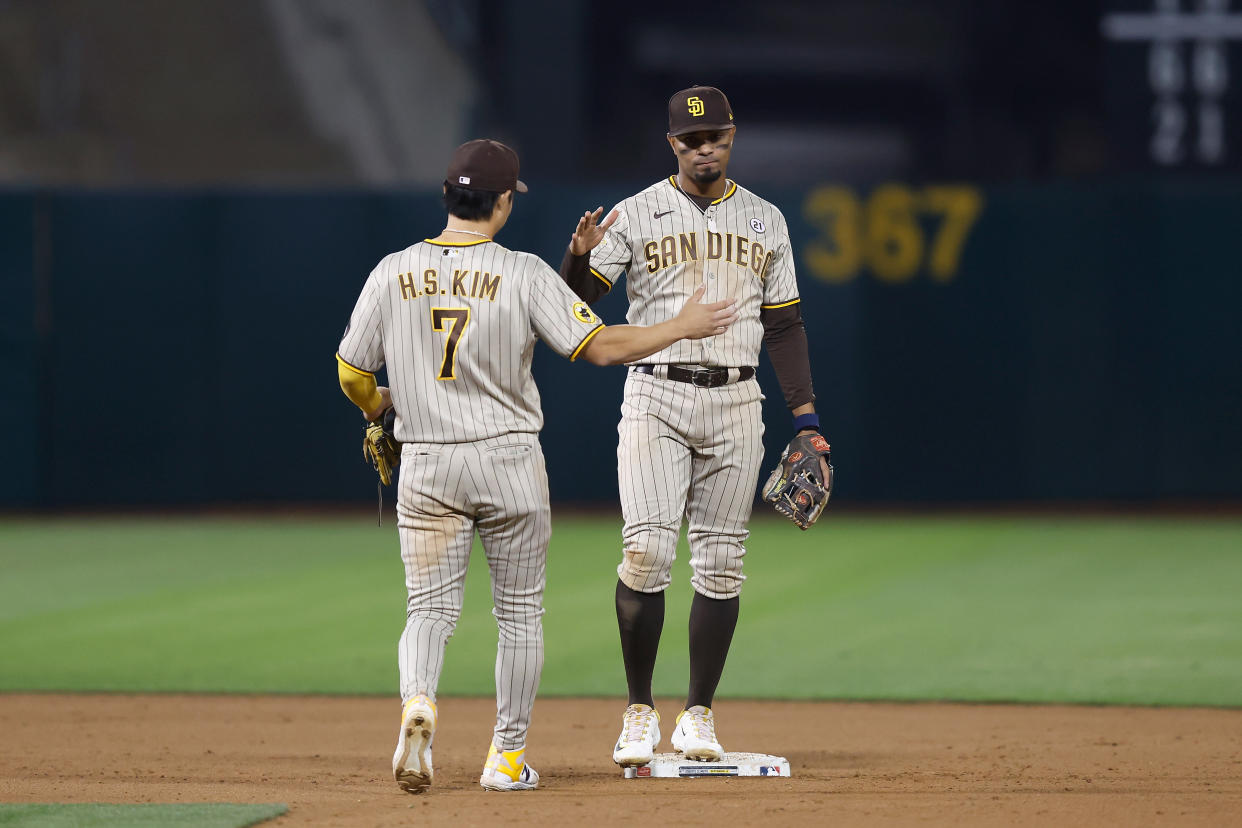 OAKLAND, CALIFORNIA - SEPTEMBER 15: Ha-Seong Kim #7 and Xander Bogaerts #2 of the San Diego Padres celebrate after a win against the Oakland Athletics at RingCentral Coliseum on September 15, 2023 in Oakland, California. (Photo by Lachlan Cunningham/Getty Images)