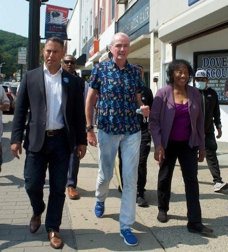 Dover Ward 3 alderman Ed Correa, left, and Mayor Carolyn Blackman walk in downtown Dover in a 2021 file photo.
