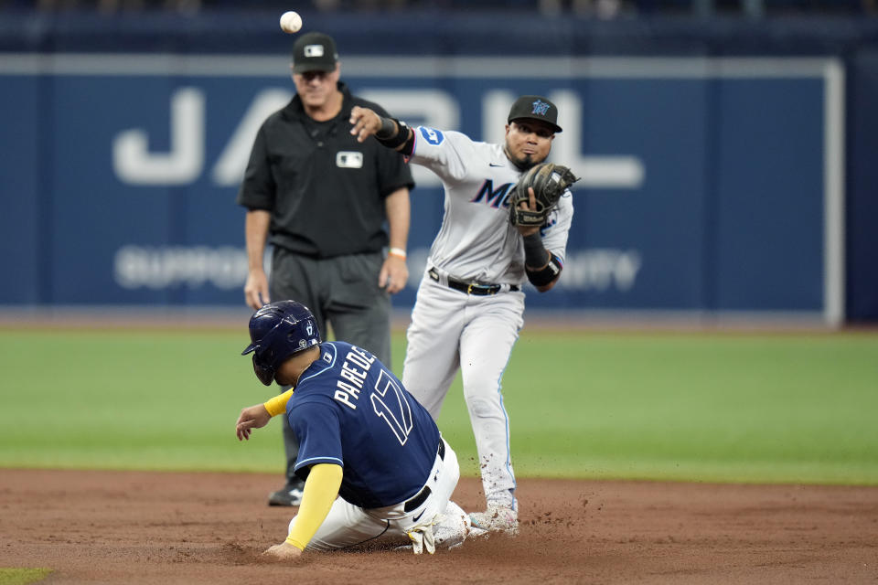 Tampa Bay Rays' Isaac Paredes (17) is forced at second base by Miami Marlins second baseman Luis Arraez on a fielder's choice by Manuel Margot during the second inning of a baseball game Tuesday, July 25, 2023, in St. Petersburg, Fla. (AP Photo/Chris O'Meara)