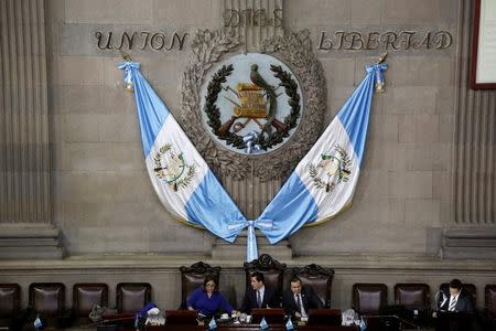 Oscar Chinchilla (C), president of Guatemala's Congress, heads a meeting where lawmakers voted to preserve President Jimmy Morales's (not pictured) immunity from prosecution, in Guatemala City, Guatemala September 11, 2017. REUTERS/Luis Echeverria