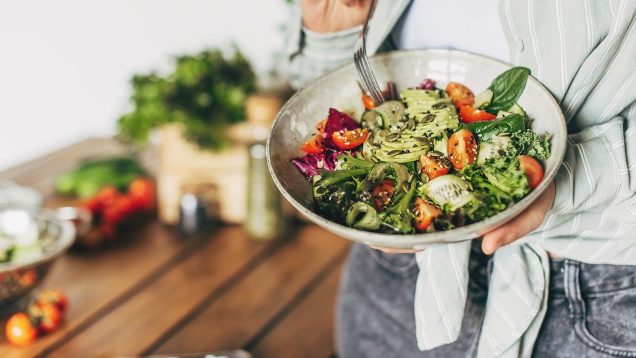 woman eating salad